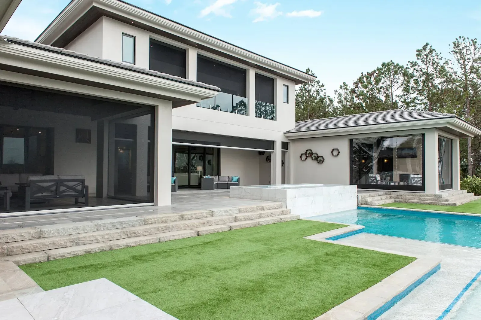 Motorised Executive screens across the openings of a large modern home