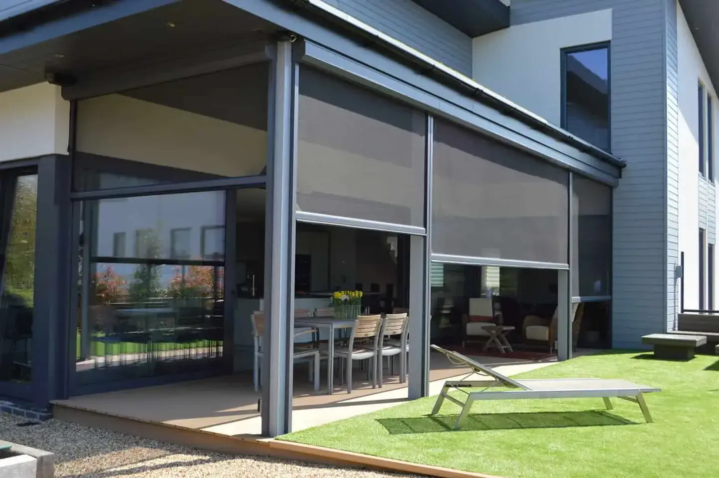 A covered patio enclosed with motorised outdoor screens