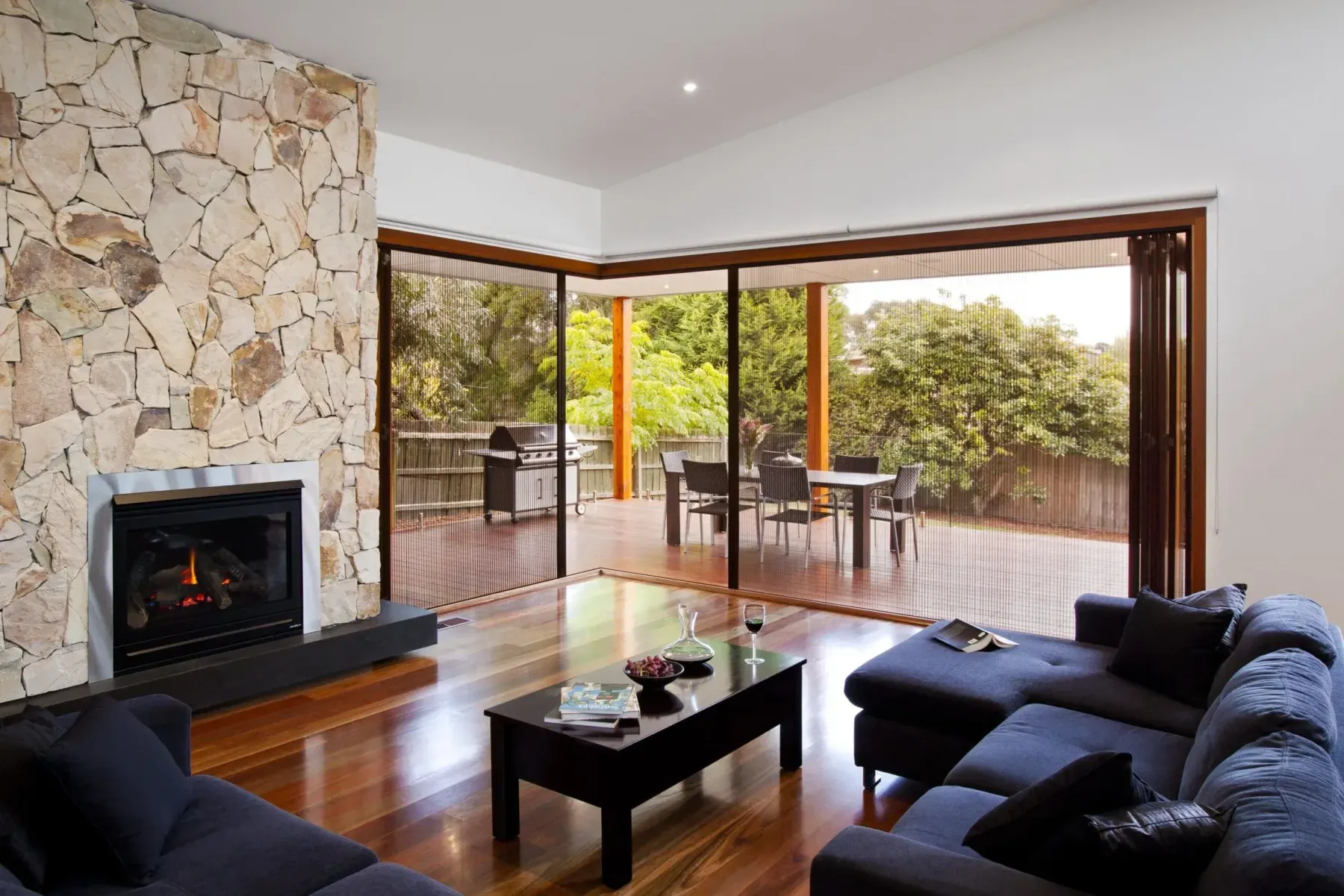 Brio 612 pleated screen across a postless bi-fold opening onto a deck